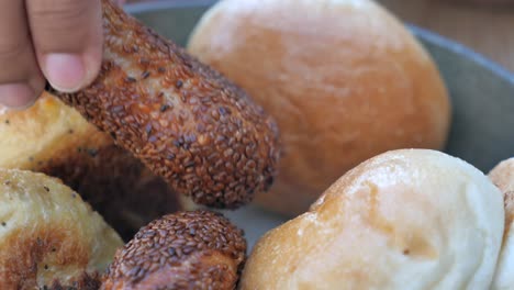 close up of a bowl of bread rolls