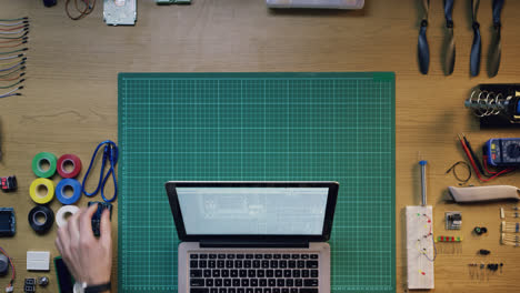 top view software engineer hands coding  at desk from above - red epic dragon