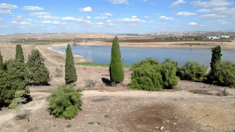 drone view over village next to water reservoir
