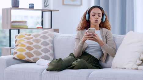 Happy-woman-enjoying-music-by-her-favorite-singer