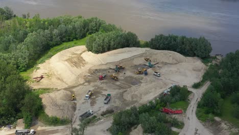 Aerial-view-loading-bulldozer-in-open-air-quarry