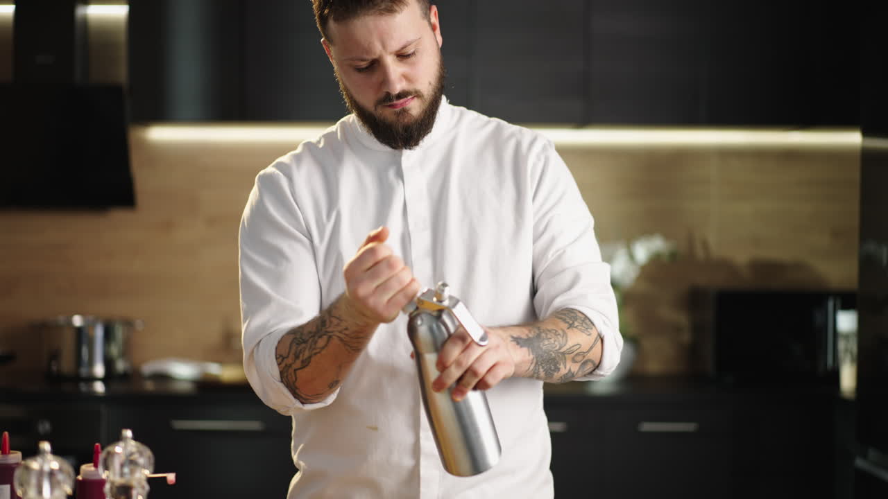 Chef using whipped cream dispenser