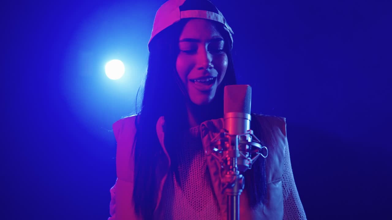 Singer performing on stage with microphone