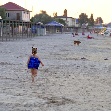 girl running on sand at beach