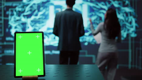 green screen tablet used by computer scientists in ai startup