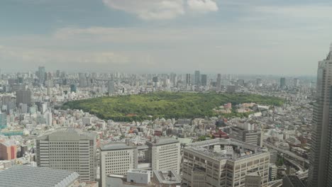 a captivating timelapse showcases tokyo's skyline and shinjuku gyoen park, viewed from the tokyo metropolitan government building's observation platform, blending urban vibrancy with natural serenity.