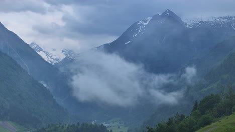 patches of dense heavy fog threatens to cover beautiful valley