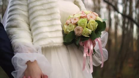 bride and groom walking in the park 03