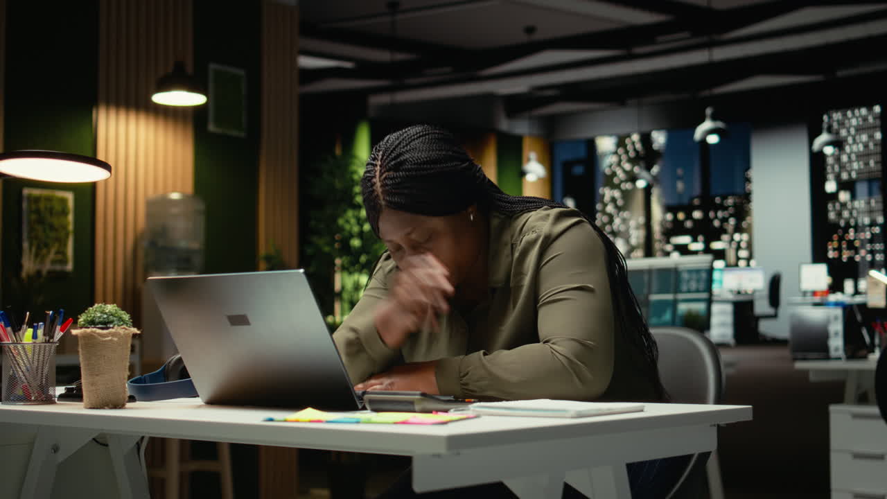 African american drained woman experiencing weariness after hours at desk