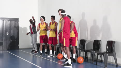 basketball team celebrating victory on court, smiling and cheering together