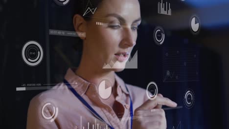 animation of graphs and processing circles over caucasian woman working in server room