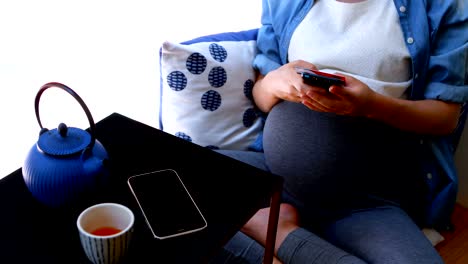 pregnant woman making payment through debit card 4k