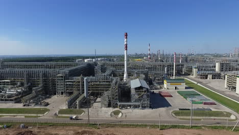 an aerial view of a huge oil refining complex on a sunny day