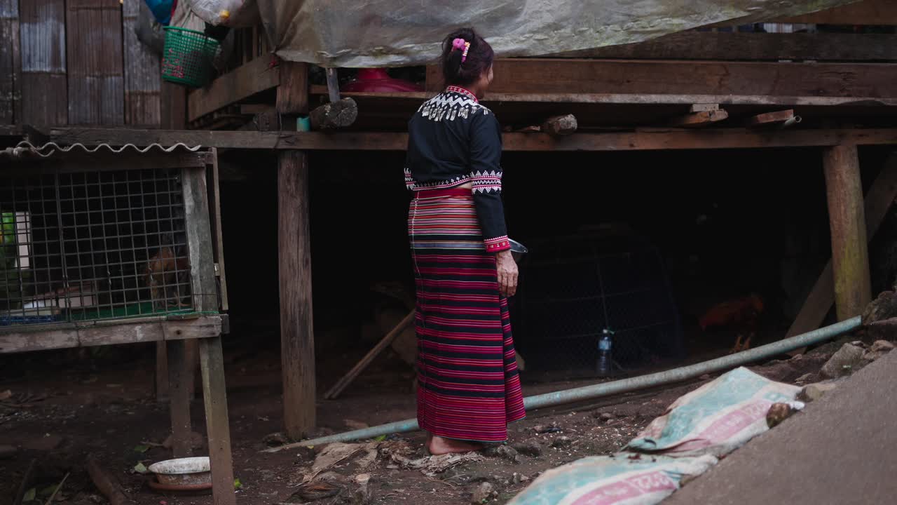 Woman in Traditional Clothing in Rural Setting