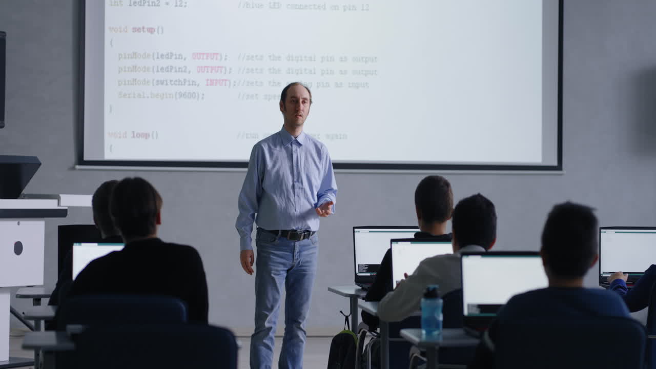 Teacher Presenting a Coding Lesson in a Classroom