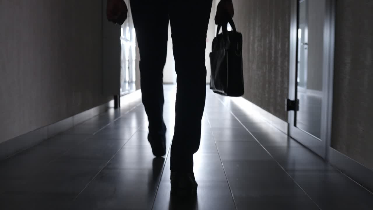 Businessman walking down a hallway