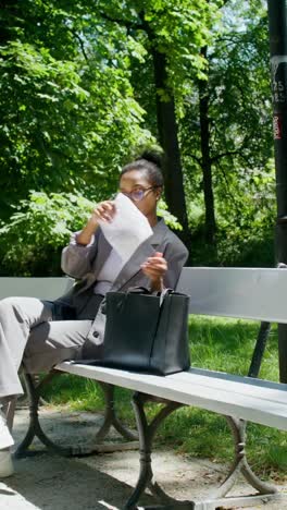 woman sitting on a park bench