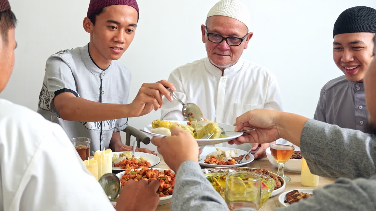 Portrait of Multi Generation Muslim Family Talking While Eating Together at Dining Room on Ramadan Moment