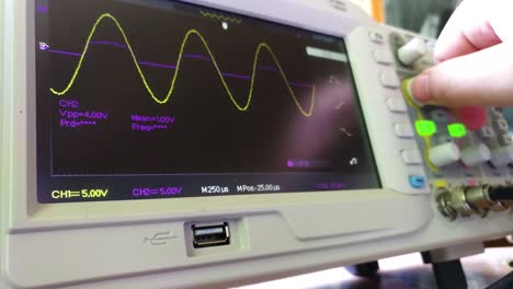 man using oscilloscope