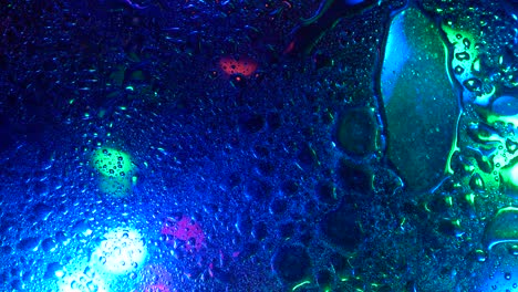 fondo colorido y textura aceite con superficie de agua espuma de jabón con burbujas