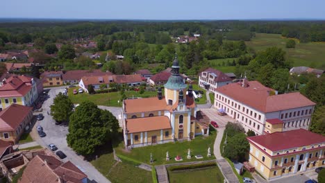 breathtaking aerial top view flight church on hill at village chlum in czech republic europe, summer day of 2023