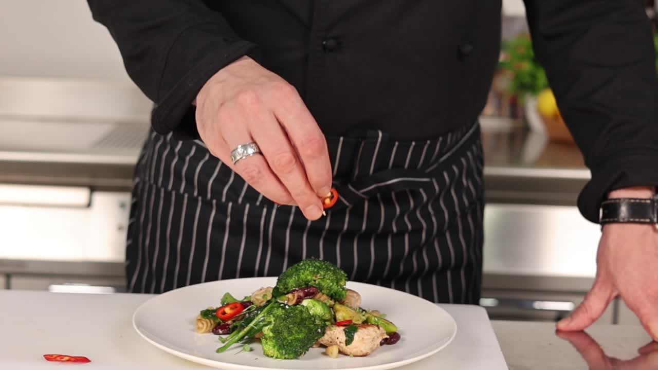 Chef Preparing a Delicious Pasta Dish with Meatballs, Broccoli, and Beans