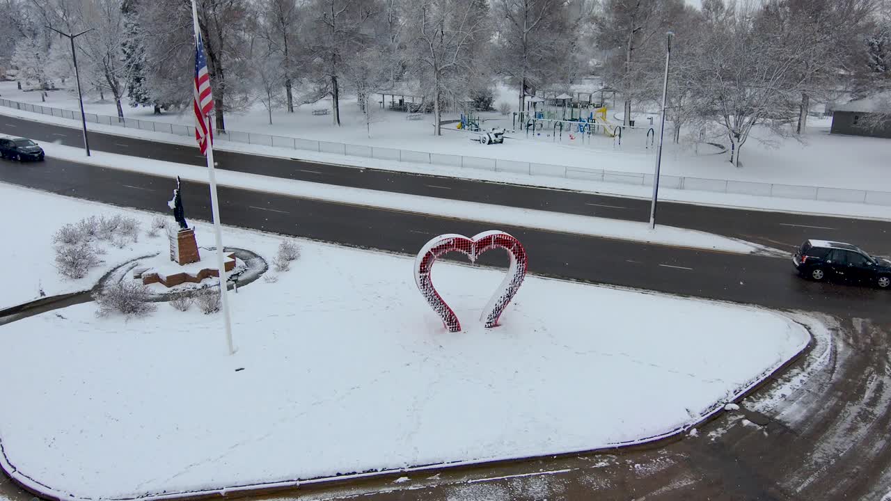 Drone descends to a heart shaped sculpture in Loveland Colorado