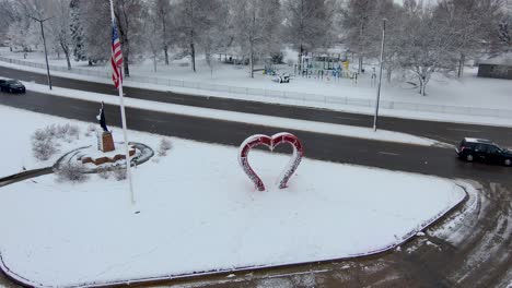 drone descends to a heart shaped sculpture in loveland colorado