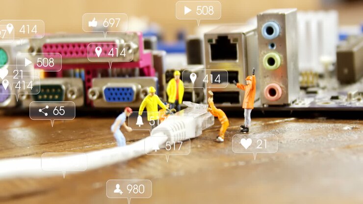 Animation of multiple social media icons against close up of little workers repairing motherboard