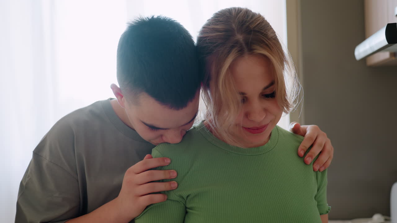 Teen embraces aunt with eyes closed as she smiles softly, sharing heartwarming family connection filled with affection, comfort, and tenderness during intimate bonding moment