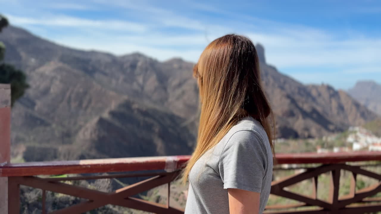 Tourist enjoying panoramic view of Roque Bentayga from Tejeda in Gran Canaria