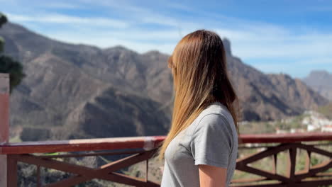 tourist enjoying panoramic view of roque bentayga from tejeda in gran canaria
