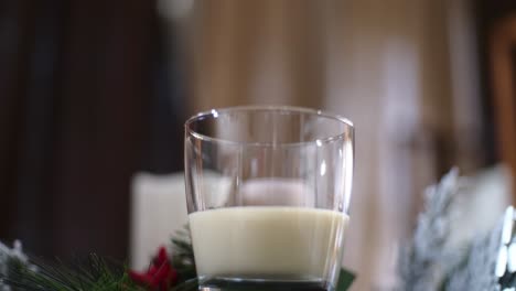 slow push in of a glass a traditional holiday drink christmas eggnog without cinnamon