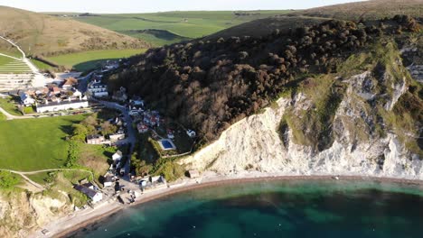 aerial panning left shot of lulworth cove dorset england