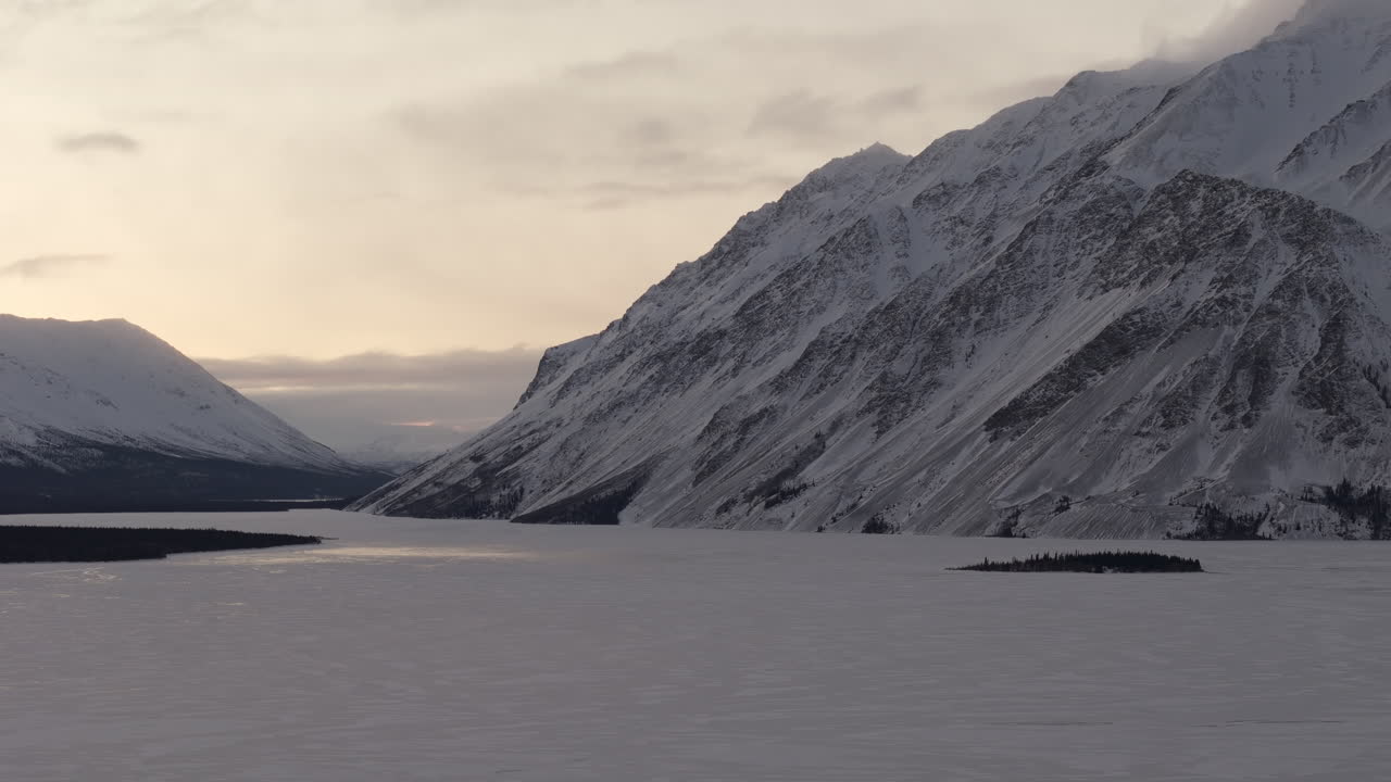 Freezing Landscape Of Kathleen Lake With Rocky Mountains During Winter In Kluane National Park and Reserve, Yukon, Canada. Static Shot