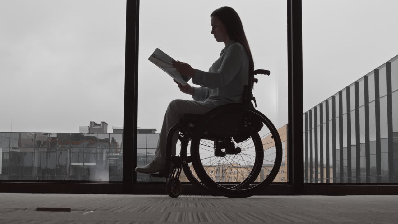 Businesswoman with Disability Reading Documents