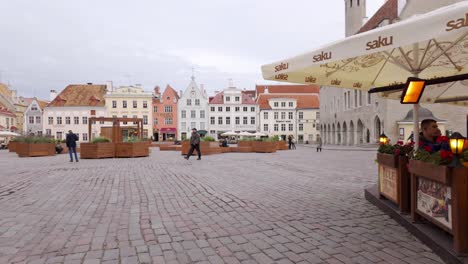 scene of people at town hall square marketplace of tallinn, estonia. pov shot