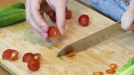 preparing a salad with tomatoes and cucumber