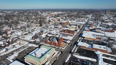 Aerial-Drone-view-of-snowy-roofs-in-Warren,-OH