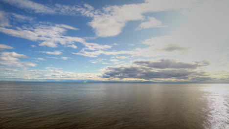 hyperlapse flying over the ocean through the clouds