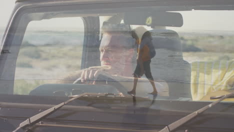 driving car, man envisioning animation of woman walking on beach