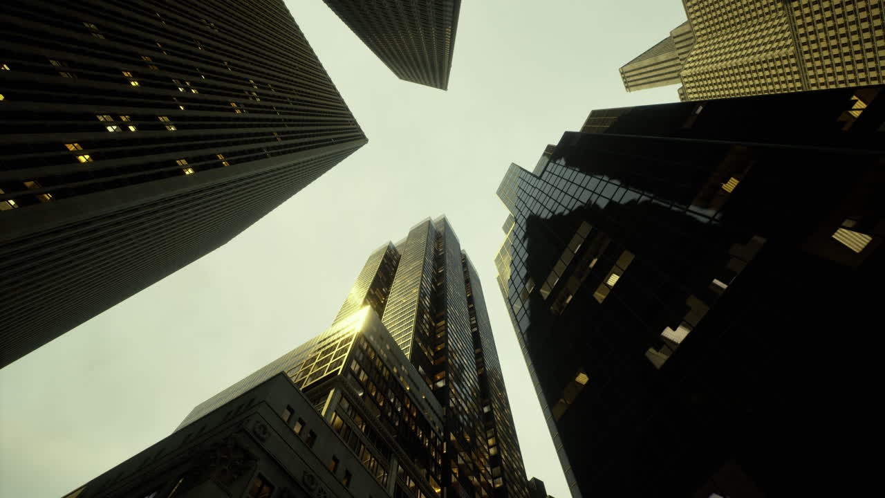 Skyscrapers rise above city streets during dusk with glass reflections