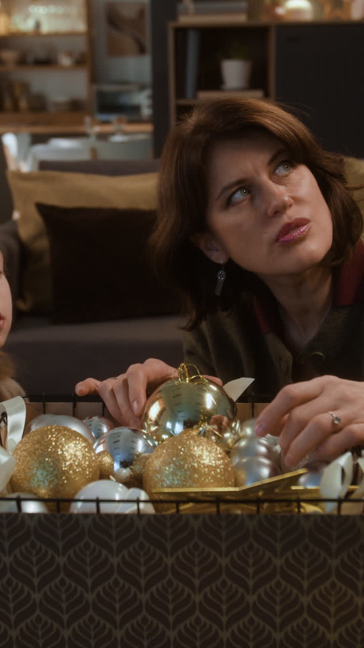 Woman decorating with Christmas ornaments