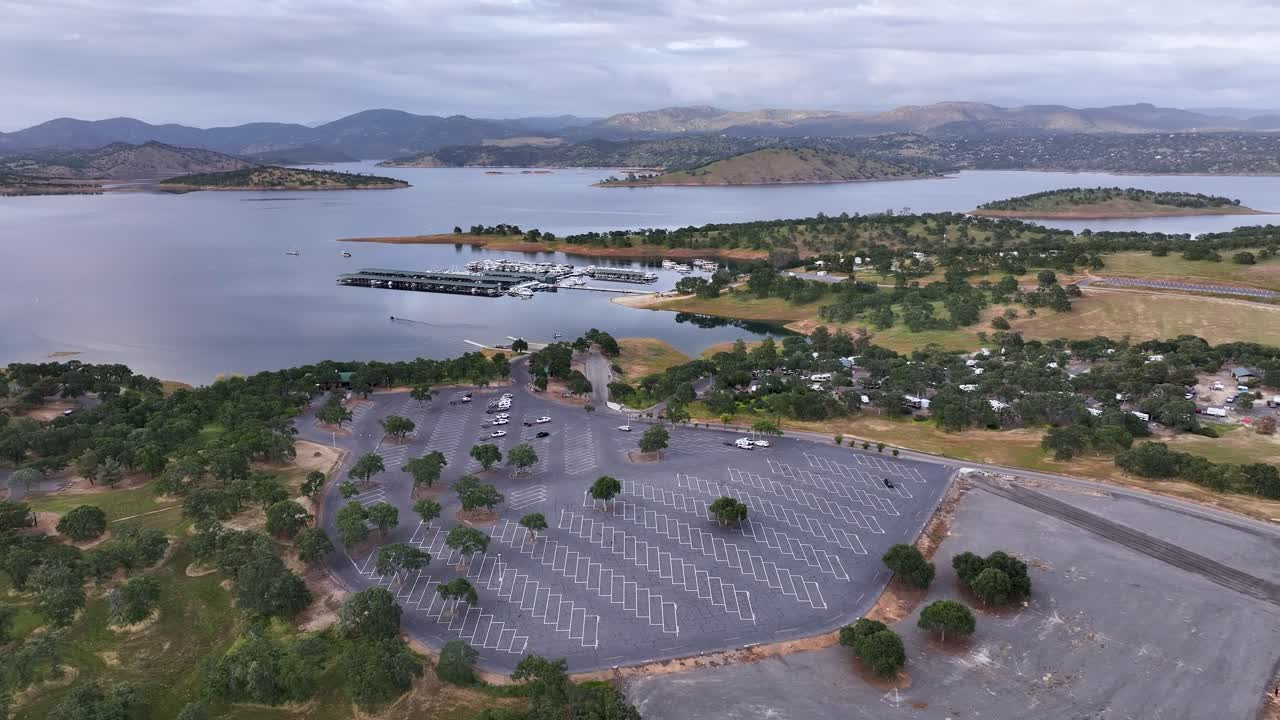 Aerial pan of Don Pedro Lake with a rain storm approching