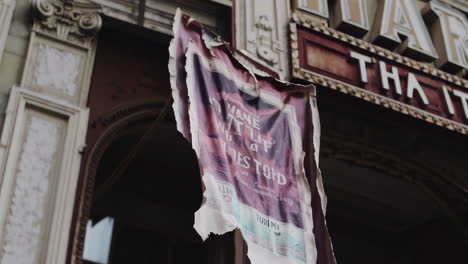 weathered theater poster