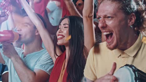 group of fans cheering for sports team