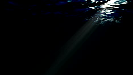 4k looping animation of ocean waves from underwater with floating plankton. light rays shining through. background. deep sea dark blue. motion graphic and animation background.