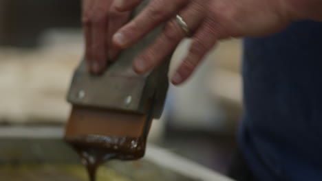 ink being applied during screen printing process