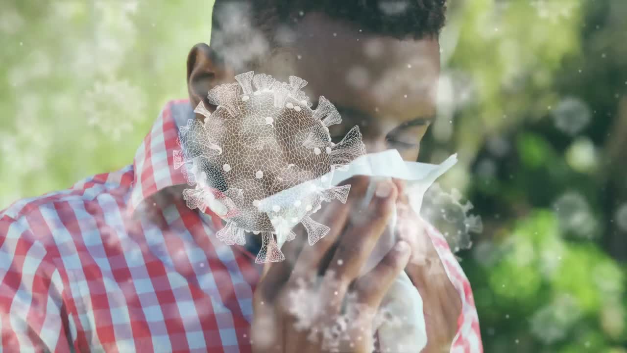 융합 인종 남자가 조직으로 재채기를 하는 거대한 코로나19 세포의 애니메이션