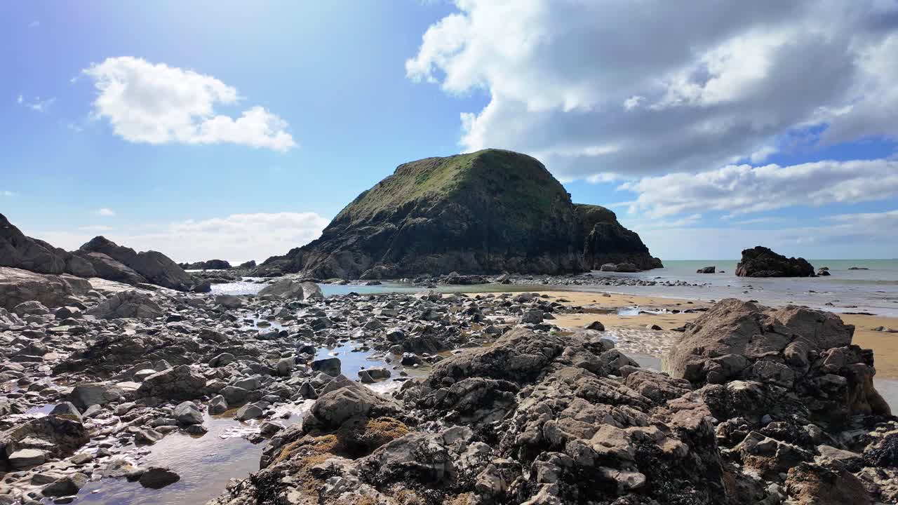 Ireland Coastline rocky beach and island at low tide Copper Coast Waterford